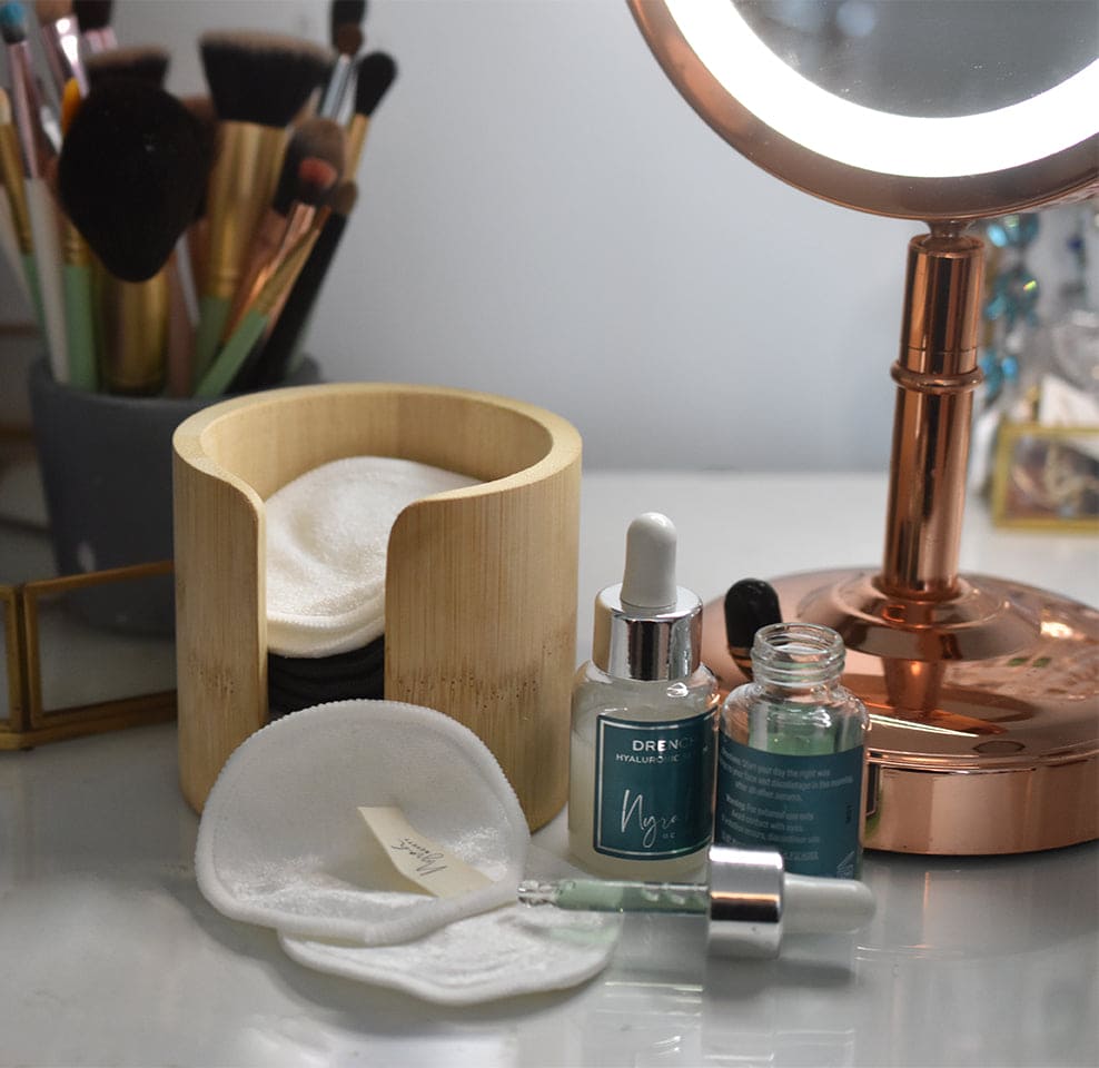 lifestlye image of bamboo barrel makeup remover pads