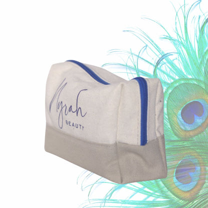 NYRAH BEAUTY Recycled Cotton Cosmetics Travel-Wash Bag SIDE view with peacock feathers in background